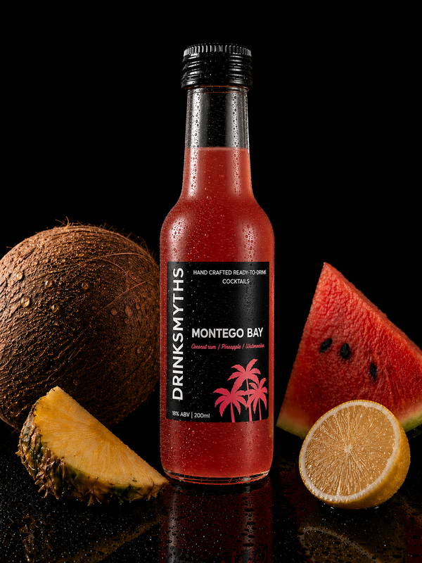 Bottle of Drinksmyths Montego Bay cocktail mix with fruits on a black background